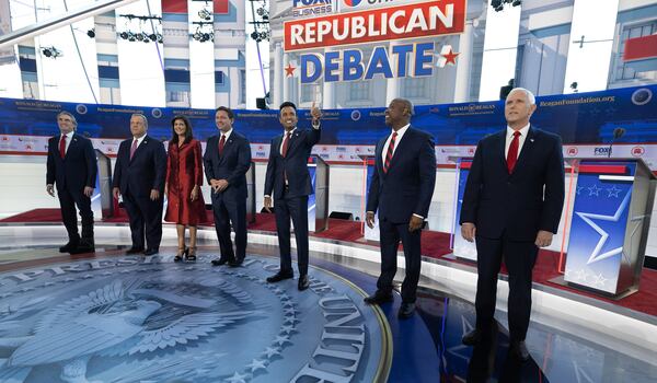 GOP presidential candidates, from left, Doug Burgum, Chris Christie, Nikki Haley, Ron DeSantis, Vivek Ramaswamy, Tim Scott and Mike Pence meet the crowd before the start of the second GOP debate, at the Ronald Reagan Presidential Library in Simi Valley, California, on Wednesday, Sept. 27, 2023. (Myung J. Chun/Los Angeles Times/TNS)