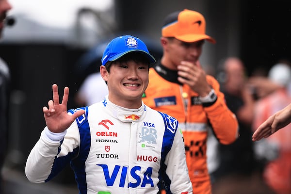 RB driver Yuki Tsunoda of Japan, celebrates his third place after the qualifying session ahead of the Brazilian Formula One Grand Prix at the Interlagos race track, in Sao Paulo, Brazil, Sunday, Nov. 3, 2024. (AP Photo/Ettore Chiereguini)