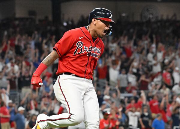 Braves' second baseman Orlando Arcia (11) celebrates his three-run home run in the 7th inning at Truist Park on Friday, July 22, 2022. Atlanta Braves won 8-1 over Los Angeles Angels. (Hyosub Shin / Hyosub.Shin@ajc.com)