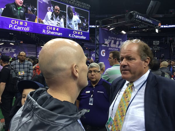 ESPN's Chris Berman talking to Dan Quinn during Media Day at Super Bowl XLIX. (By D. Orlando Ledbetter/Dledbetter@ajc.com)