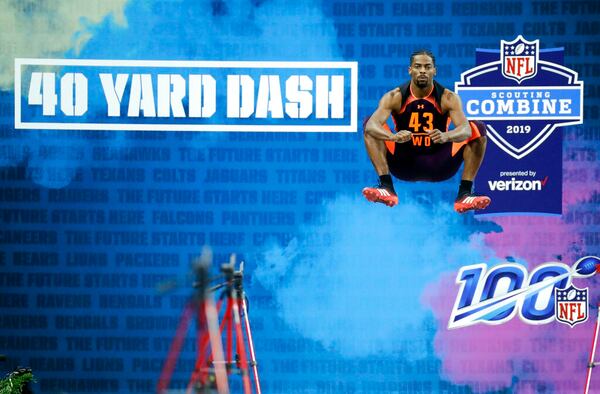 Auburn wide receiver Darius Slayton jumps before running the 40-yard dash during the combine in 2019.   (AP Photo/Darron Cummings, File)