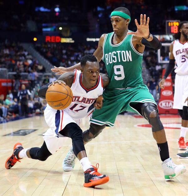 120214 ATLANTA: Hawks guard Dennis Schroder drives against Celtics Rajon Rondo leading the Hawks to a come from behind 109-105 victory in the second half of an NBA basketball game on Tuesday, Dec. 2, 2014, in Atlanta. CURTIS COMPTON / CCOMPTON@AJC.COM