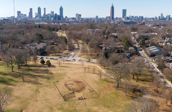 A gigantic Image of the late Congressman John Lewis, by artist Stan Herd, is visible in Freedom Park near the intersection of Moreland and North avenues on Jan. 15, 2021. (Hyosub Shin / Hyosub.Shin@ajc.com)