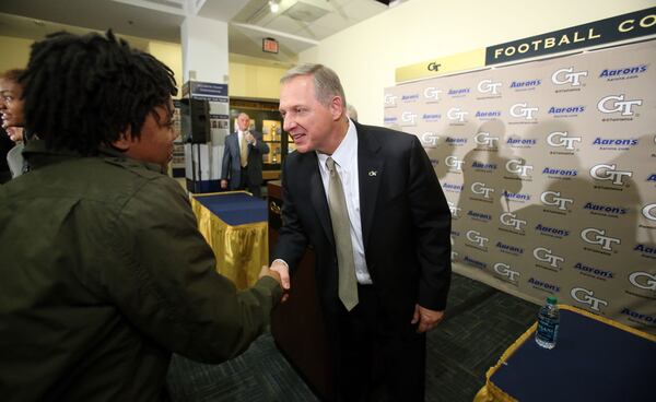 January 18, 2013 - Atlanta, Ga: New Georgia Tech Athletic Director Mike Bobinski, center, greets Georgia Tech basketball player Dawnn Maye, left, following the press conference at the Edge Building on the Georgia Tech campus Friday morning in Atlanta, Ga., January 18, 2013. Bobinski was the Athletic Director of Xavier University. Maye is a junior guard for the Georgia Tech Women's basketball team. JASON GETZ / JGETZ@AJC.COM