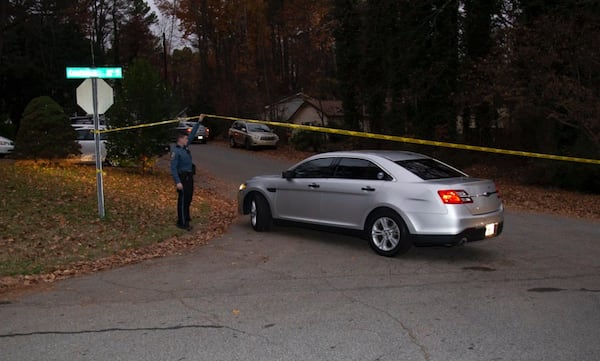 Crime scene tape blocked the entrance to Barnaby Court from Candlewick Lane, where Gwinnett County police were investigating a homicide Friday morning.