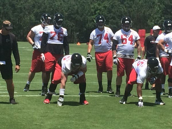 Tackle Ryan Schraeder and guard Chris Chester ready to fire off the ball. (D. Orlando Ledbetter/AJC)