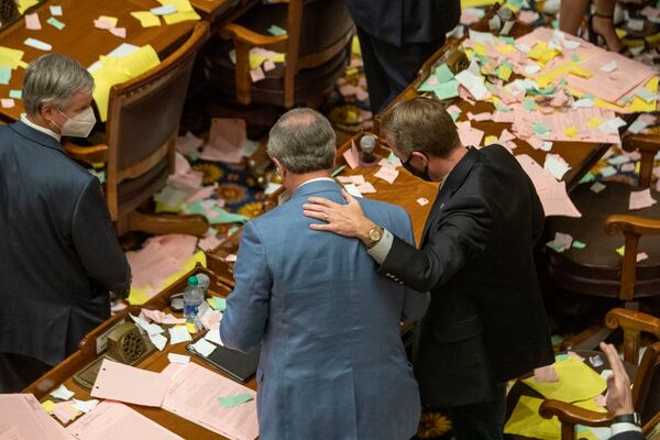 06/26/2020 - Atlanta, Georgia - Georgia Senators embrace in the Senate Chambers after the legislative session ended  on Sine Die, day 40, of the legislative session in Atlanta, Friday, June 26, 2020. (ALYSSA POINTER / ALYSSA.POINTER@AJC.COM)