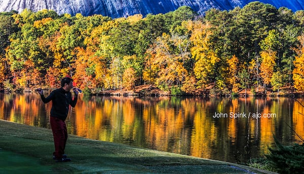 Mark Mei takes in a colorful day of golf at Stone Mountain Park. Temperatures at the park bottomed out at 37 degrees early Monday morning.