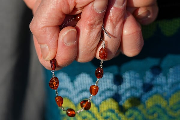 A nun holds rosary beads as she prays for Pope Francis in front of the Agostino Gemelli Polyclinic, in Rome, Sunday, March 2, 2025, where the Pontiff is hospitalised since Friday, Feb. 14. (AP Photo/Andrew Medichini)