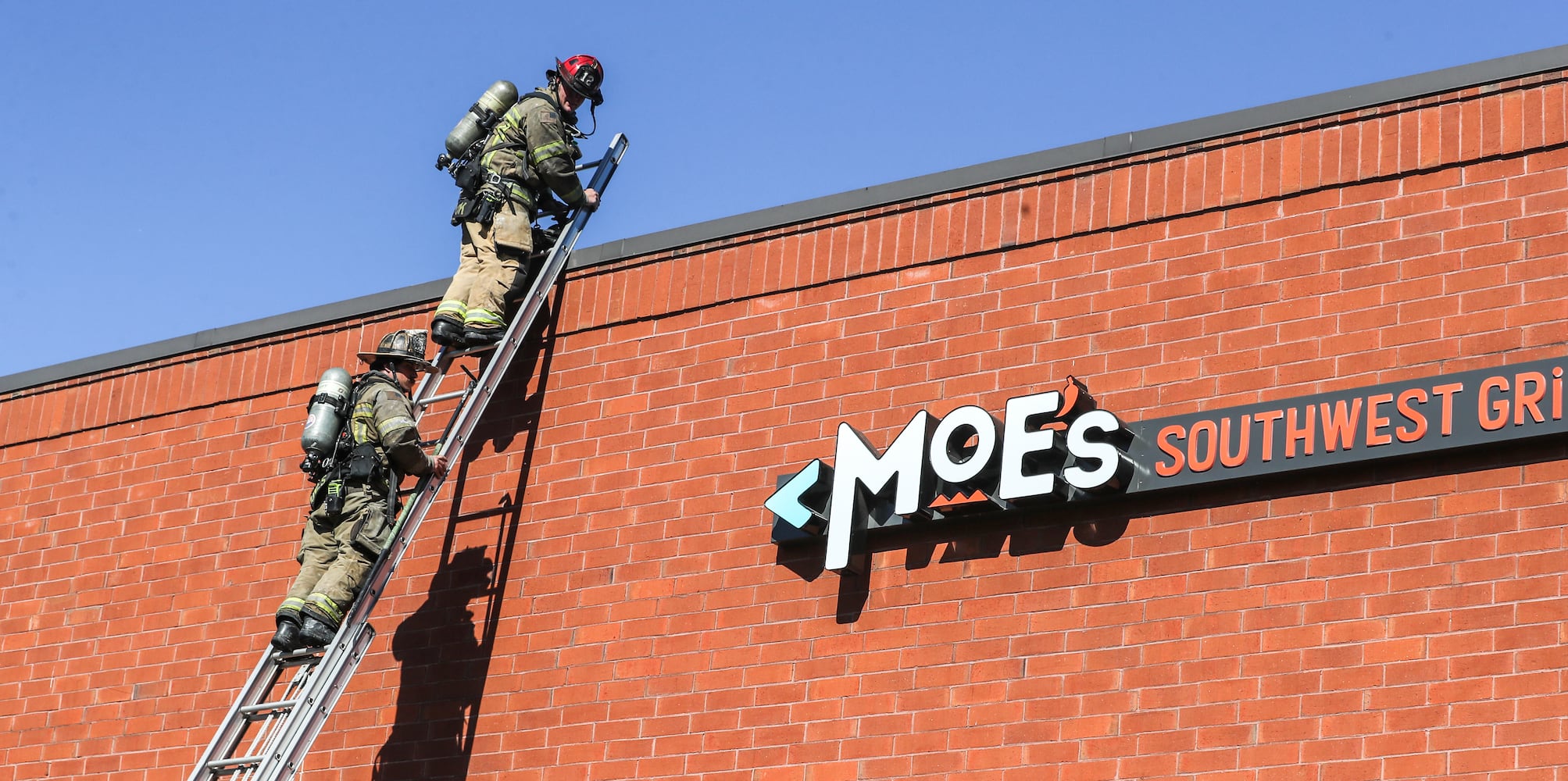 Gwinnett County fire crews were called to a fire at a Moe’s Southwest Grill on Stone Mountain Highway in the Lilburn area, about an hour after they responded to another fire at an apartment building on Spruce Circle, just outside Snellville. (John Spink / John.Spink@ajc.com) 

