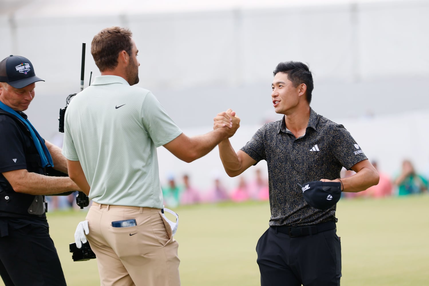 Scottie Scheffler shakes hands with Collin Morikawa after winning the Tour Championship at East Lake Golf Club, Sunday, Sept. 1, 2023, in Atlanta. 

(Miguel Martinez / AJC)