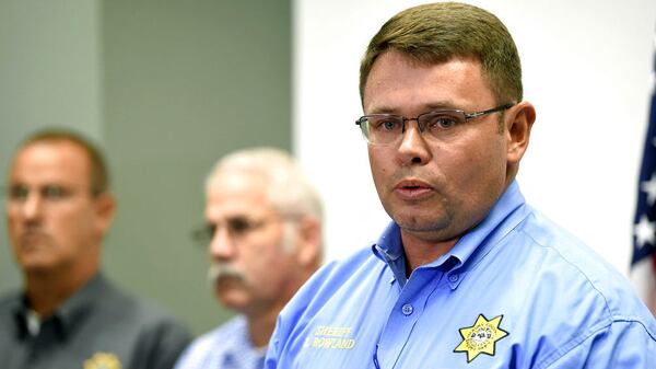 Maury County Sheriff Bucky Rowland speaks to the media Tuesday, Oct. 16, 2018, about an apparent murder-suicide that occurred the day before at a home in Columbia, Tenn. Investigators say Cynthia Collier, 55, shot and killed her four adopted children, Kaileigh Lin, 17, Lia Lin, 15, and 14-year-olds Meigan Lin and Bo Li, before taking her own life. Rowland said Collier appeared to be a “very loving mother, with the exception of this one incident.” The motive for the homicides remains unknown.