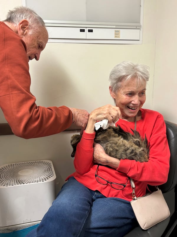 In this image provided by Carolyn Kiefer her mother, Katherine Kiefer, 82, is reunited with her cat Aggie at VCA Chatoak Animal Hospital after the Palisades Fire destroyed her home and the cat was missing, Saturday, March 8, 2025, in Los Angeles. (Carolyn Kiefer via AP)