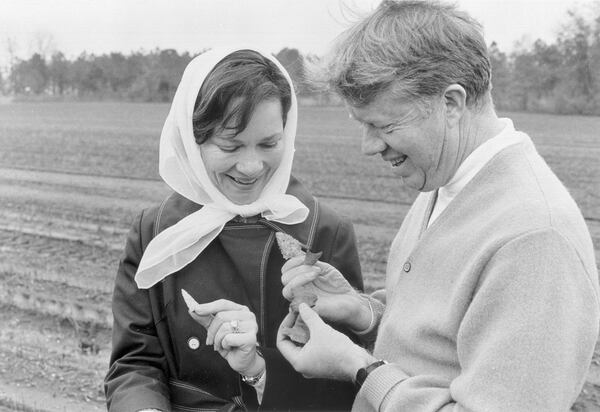 In this undated photo, Jimmy and Rosalynn Carter look at arrowheads in a field. (Carter family photo / Jimmy Carter Library)