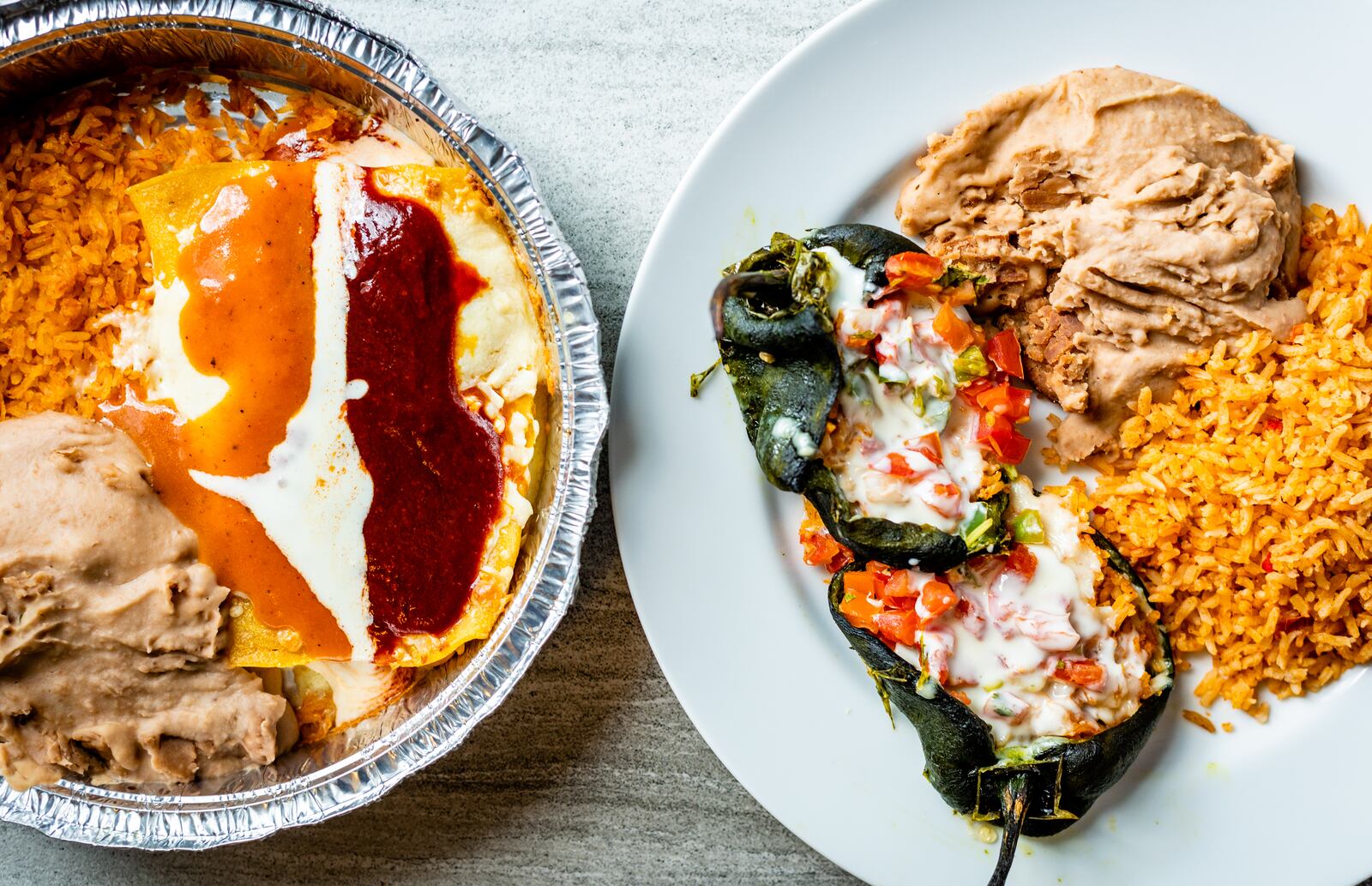 Heat-at-home chicken enchiladas (left) and chiles rellenos from El Ponce, just out of the oven. 