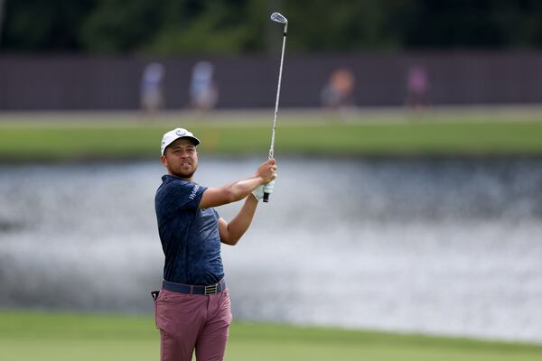 Xander Schauffele hits his second shot on the eighth fairway during the second round of the Tour Championship at East Lake Golf Club, Friday, August 26, 2022, in Atlanta. (Jason Getz / Jason.Getz@ajc.com)