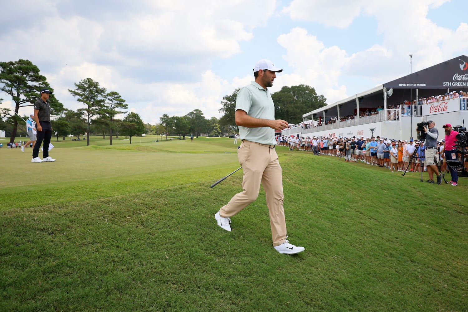 Scottie Scheffler walks out of the fifth green during the final round of the Tour Championship at East Lake Golf Club, Sunday, Sept. 1, 2024, in Atlanta.
(Miguel Martinez / AJC)