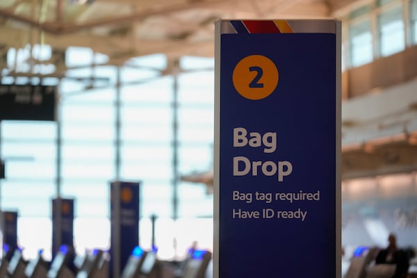 Southwest Airlines baggage signage is displayed at Midway International Airport, Tuesday, March 11, 2025, in Chicago. (AP Photo/Erin Hooley)