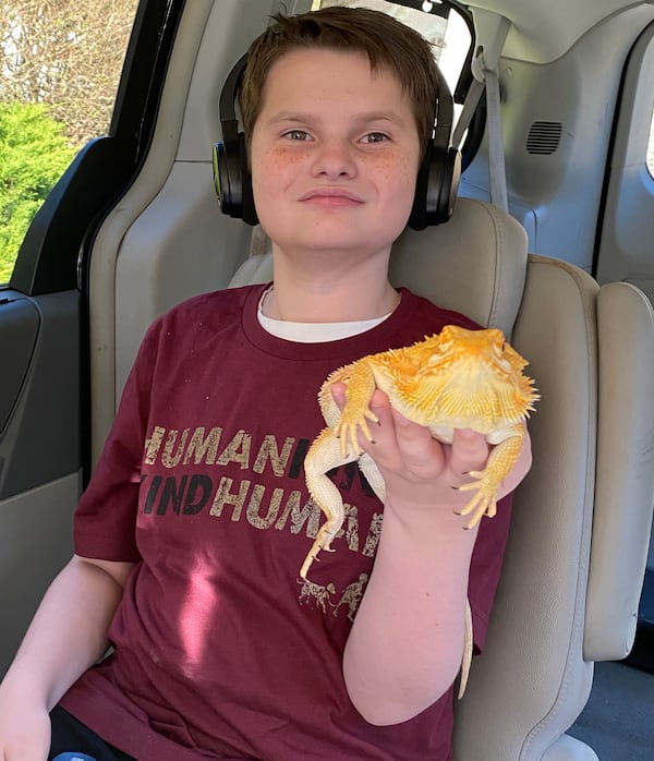 Jonny Hickey, 16, with his bearded dragon. Jonny has a love for all animals. Courtesy of Linda Hickey