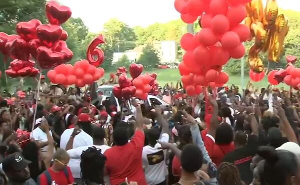 Fans and friends gathered in Coan Park on Thursday for a vigil for slain rapper Trouble.