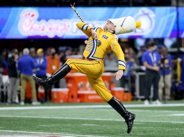 Pittsburgh Panthers' drum major performs before the Chick-fil-A Peach Bowl between the Pittsburgh Panthers and the Michigan State Spartans at Mercedes-Benz Stadium in Atlanta, Thursday, December 30, 2021. JASON GETZ FOR THE ATLANTA JOURNAL-CONSTITUTION



