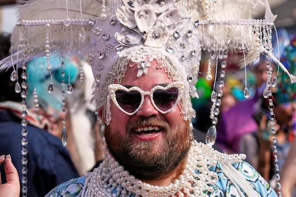 A man wears a costumes during the Society of Saint Anne's parade on Mardi Gras Day, Tuesday, March 4, 2025 in New Orleans. (AP Photo/Gerald Herbert)