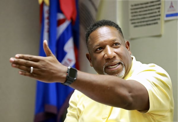 Airport director Mario Evans answers questions from residents on plans to build 8 new hangers close to Clairmont Road. (Photo: Curtis Compton/ccompton@ajc.com)