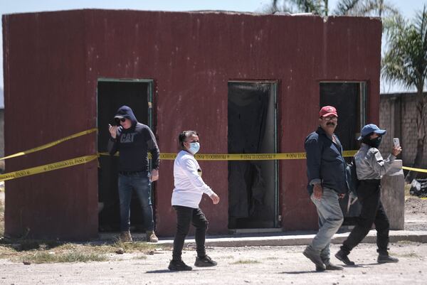 The relatives of missing people gather at Izaguirre Ranch to see if they can identify skeletal remains that were discovered in Teuchitlan, Jalisco state, Mexico, Thursday, March 13, 2025. (AP Photo/Alejandra Leyva)