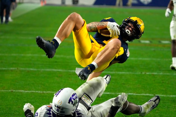 Michigan wide receiver Roman Wilson (14) during the first half of the Fiesta Bowl NCAA college football semifinal playoff game against TCU, Saturday, Dec. 31, 2022, in Glendale, Arizona. (AP Photo/Rick Scuteri)