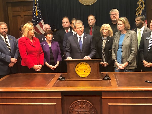 Gov. Brian Kemp unveiled a plan Thursday that would invest more than $300 million in public money into reinsurance — money that would be paid to insurance companies and meant to trickle down and lower premium prices. The plan would also require the state to build its own online system that would guide residents to private web brokers who could sell them insurance.