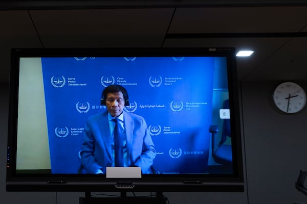 Former Philippine President Rodrigo Duterte is seen on a screen in the courtroom of the International Criminal Court (ICC) in The Hague, Netherlands, Friday, March 14, 2025. (AP Photo/Peter Dejong, Pool)