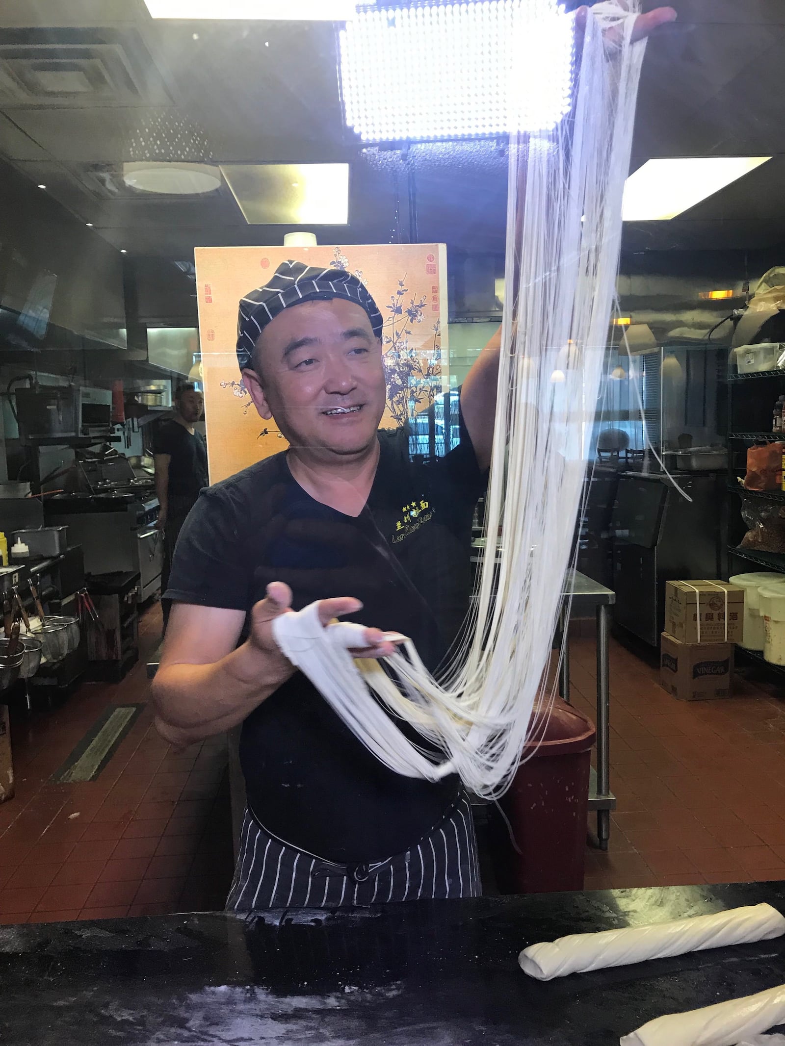 Fu Li Zhang pulls noodles at LanZhou.