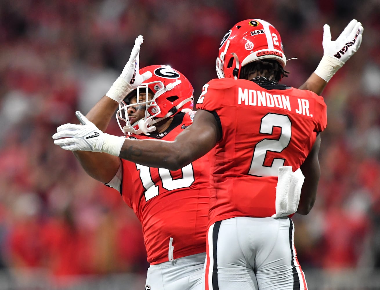 Georgia Bulldogs linebacker Smael Mondon Jr. (2) celebrates with Jamon Dumas-Johnson (10) after Mondon sacked Ohio State Buckeyes quarterback C.J. Stroud (7) for a ten-yard loss. (Hyosub Shin / Hyosub.Shin@ajc.com)