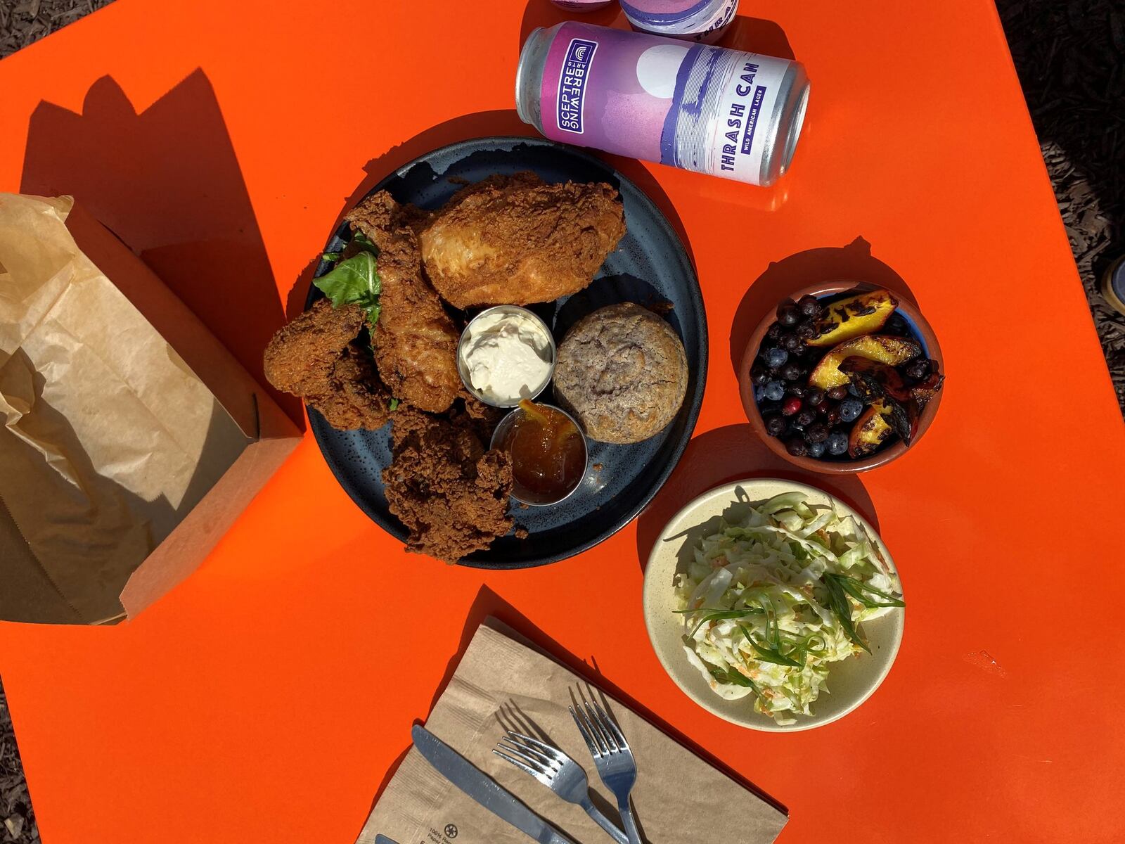 The eight-piece picnic meal includes a whole Springer Mountain fried chicken, with slaw, corn muffins, berries, and a four-pack of beer. CONTRIBUTED BY ARGOSY