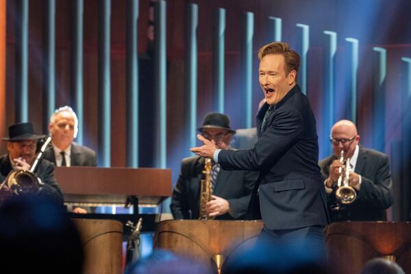 Comedian Conan O'Brien walks out on stage at the start of the 25th Annual Mark Twain Prize for American Humor Celebrating Conan O'Brien, Sunday, March 23, 2025, at the Kennedy Center for the Performing Arts in Washington. (AP Photo/Kevin Wolf)