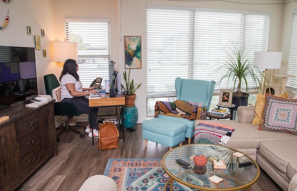 Hannah Evon working at home in Atlanta on Thursday, Oct. 21, 2021 after a 10-month-long search for her perfect job. (Jenni Girtman for The Atlanta Journal-Constitution)