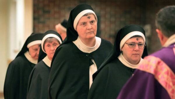 From left, sisters Mary Walter, Mary Kateri, Mary Damien and Mary Augustine wait to receive Holy Communion in an earlier staff photo.