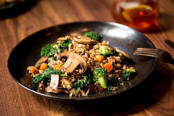 Wild Rice Vegetable Bowl with sauteed mushrooms, roasted carrots, steamed spinach, tossed with wild rice and topped with ponzu sauce. Photo credit- Mia Yakel.