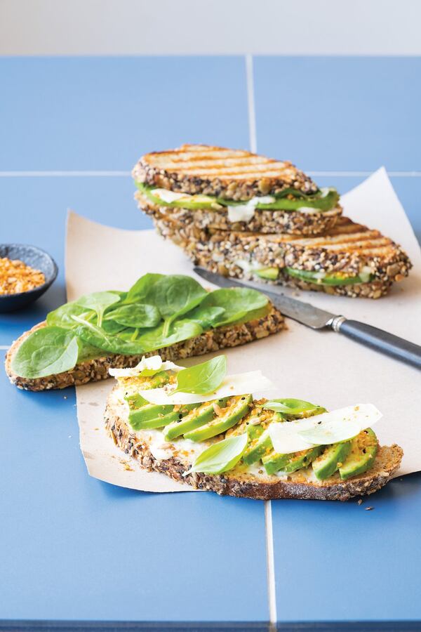 This Spinach, Avocado and Dukkah sandwich is brightly flavored with its spice mix, herbal from the addition of basil leaves and bright green with its spinach and avocado filling. CONTRIBUTED BY: Hardie Grant Books