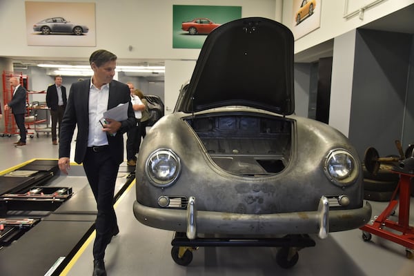 Klaus Zellmer, president and CEO of Porsche Cars North America, Inc., reviews a car at Porsche Classic Factory Restoration facility in the Porsche Experience Center Atlanta on Friday, October 26, 2018. RM Sotheby’s, in collaboration with the Porsche Experience Center Atlanta, is delighted to announce The Porsche 70th Anniversary Auction, an exclusive, single-marque auction to be held at the ground-breaking home of Porsche Cars North America (PCNA) in Atlanta. Set for the weekend of 27 October, the sale shortly follows official U.S. 70th anniversary celebrations taking place as part of Porsche Rennsport Reunion VI and will feature approximately 70 of the world’s most important and most sought-after collectible Porsche models, spanning the marque’s illustrious 70-year history as a sports car manufacturer. HYOSUB SHIN / HSHIN@AJC.COM