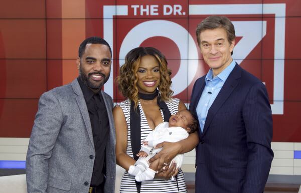 Kandi Burruss with husband Todd Tucker and baby Ace on the Dr. Oz show. Photo: Sony Pictures Television