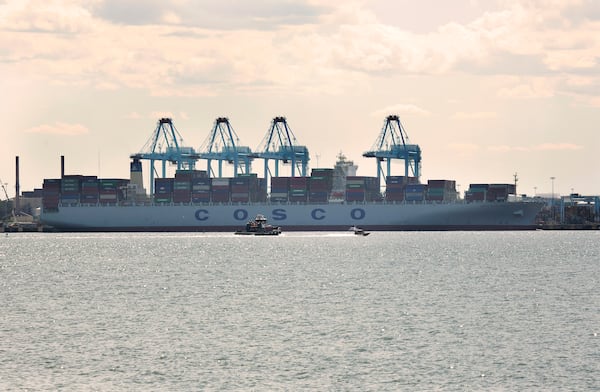 The container ship COSCO Development, which arrived at the Port of Virginia overnight, sits docked at Virginia International Gateway in Portsmouth, Va., Monday, May 8, 2017. The COSCO Development, the biggest ship to ever call on the East Coast, pulled into the port Monday and will head out early Tuesday morning. (Kristen Zeis/The Virginian-Pilot via AP)