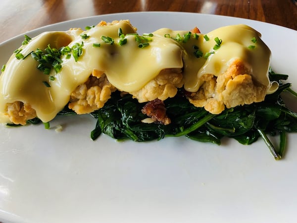 Fried Gulf oysters Rockefeller, with spinach, bacon and hollandaise sauce, are available at Kaiser’s Chophouse. Bob Townsend for The Atlanta Journal-Constitution 