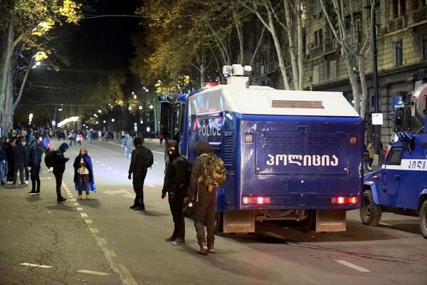 A police water cannon stands ready during a rally outside the parliament's building to protest the government's decision to suspend negotiations on joining the European Union for four years in Tbilisi, Georgia, on Friday, Nov. 29, 2024. (AP Photo/Zurab Tsertsvadze)