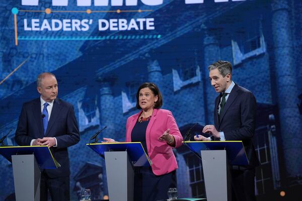 Tanaiste and Fianna Fail Leader Micheal Martin, from left, Sinn Fein leader Mary Lou McDonald and Taoiseach and Fine Gael leader Simon Harris speak during the final TV leaders' debate, at RTE studios in Donnybrook, Dublin, ahead of the Nov. 29, General Election Tuesday, Nov. 26, 2024. (Niall Carson/PA via AP)