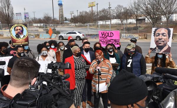 Rayshard Brooks' wife Tomika Miller speaks to members of the press on February 4, 2021, as state Rep. Erica Thomas (left) comforts her across street from the site of the Wendy's restaurant where an Atlanta police officer fatally shot Brooks in June. A coalition of elected officials, organizers and activists held the press conference to express their disappointment in newly elected Fulton County District Attorney Fani Willis. (Hyosub Shin / Hyosub.Shin@ajc.com)