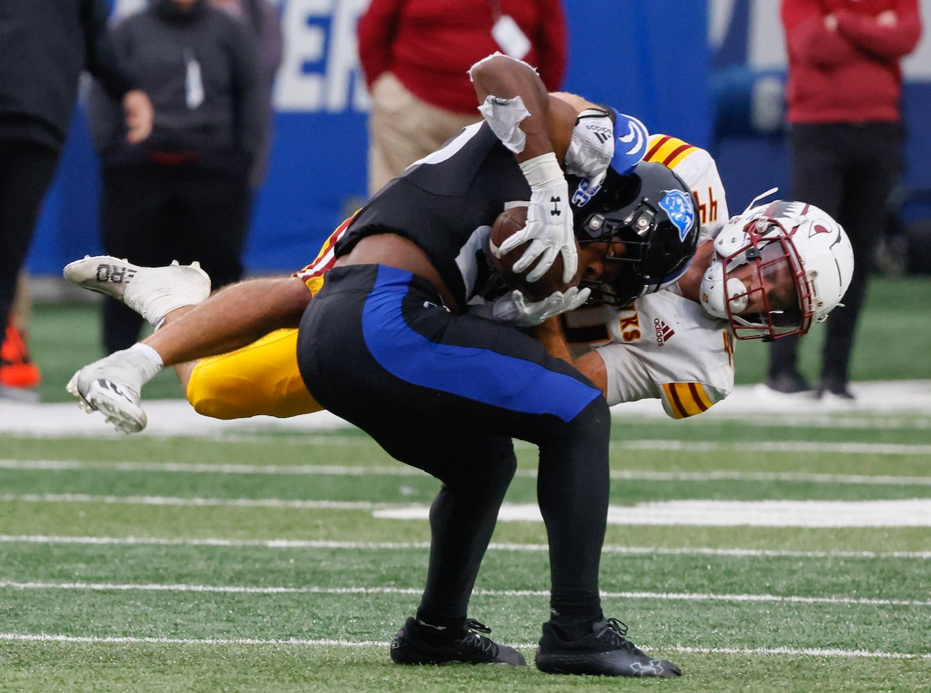 Louisiana-Monroe Warhawks linebacker Michael Batton (44) puts the stop on Georgia State Panthers running back Marcus Carroll (23).  (Bob Andres for the Atlanta Journal Constitution)