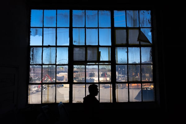 Braden Fellman portfolio manager Sean Gilligan stands in a building that used to be Johnson-Fluker Wholesale Candy Manufacturing Company’s factory in Atlanta on Wednesday, October 16, 2024. The building, which is now part of a scrap yard, is part of the Abrams Fixtures adaptive reuse project. (Arvin Temkar / AJC)