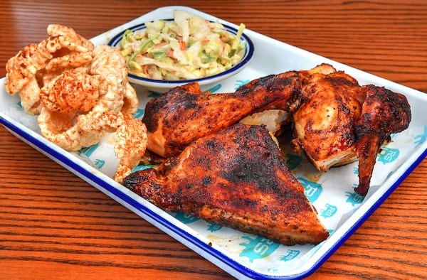 Though Rodney Scott is best known for his way with whole hog barbecue, his menu has grown over the years. Here is the 1/2 Bird Chicken plate with sides of skins and coleslaw at Rodney Scott's Whole Hog BBQ in Atlanta, his newest restaurant. (Chris Hunt for The Atlanta Journal-Constitution)