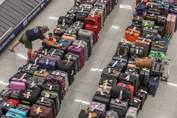 Rows of baggage on the floors in the baggage claim area of the domestic terminal at Hartsfield-Jackson International Airport in Atlanta on Tuesday, July 23, 2024, on the fifth day of a massive global technology outage that has severely impacted the operations of Delta Air Lines.